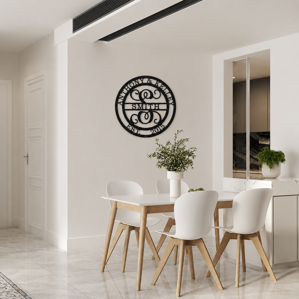 Round custom metal monogram sign with family name and established year displayed in minimalist dining room