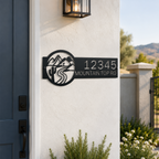 Black personalized mountain top road metal address sign mounted beside front door