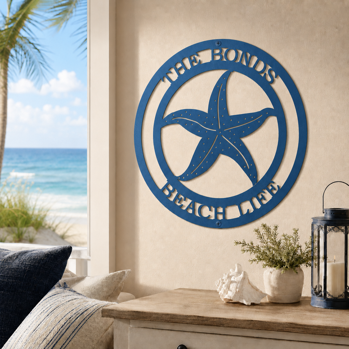 Medium blue finish of a custom metal starfish sign with personalized family text, styled indoors above a wooden entryway console table with beach decor.