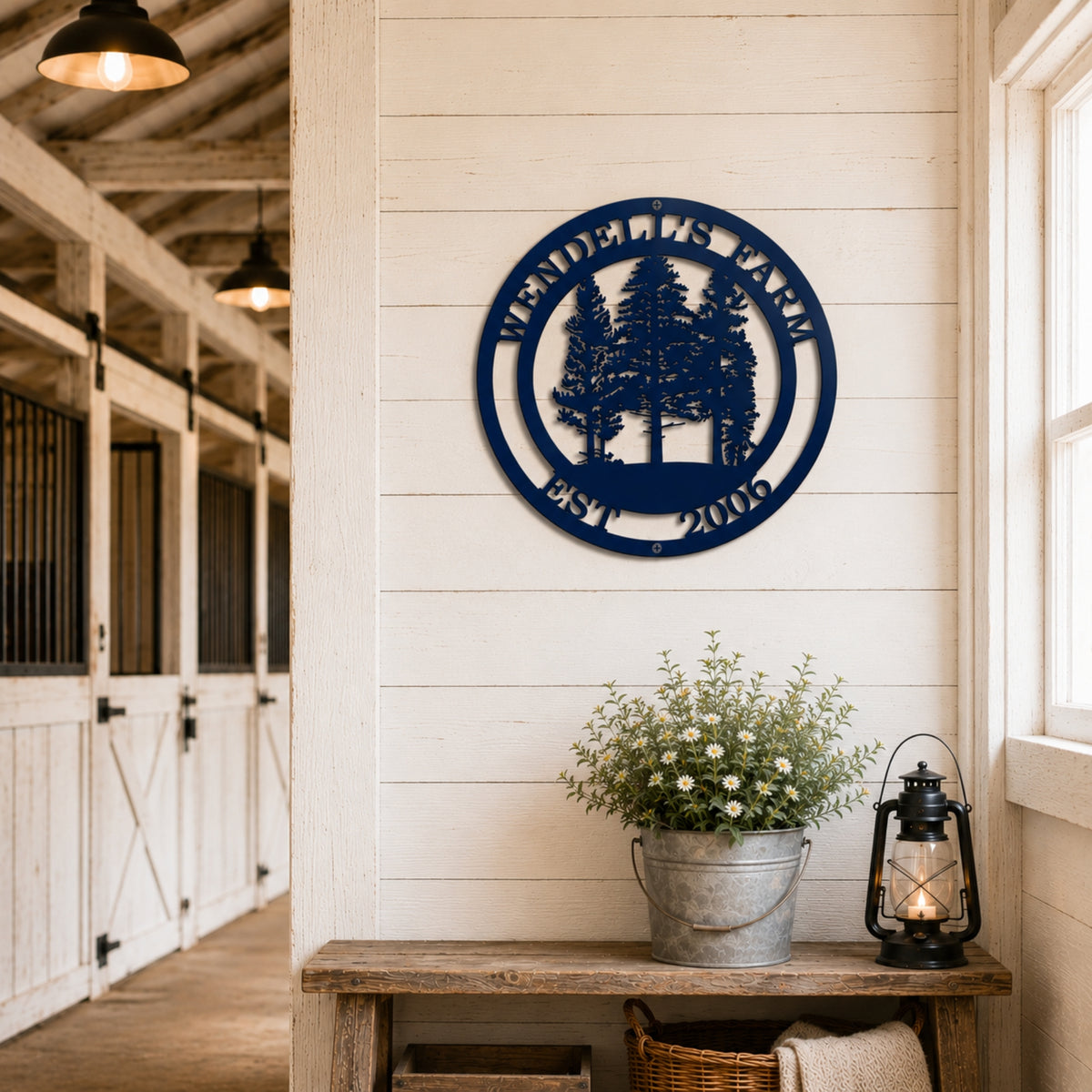 Round navy blue ranch metal wall art mounted above rustic barn doors with personalized ranch name and established year