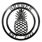 Black personalized pineapple metal wall sign with Brewer family name and established 2022 text on white background
