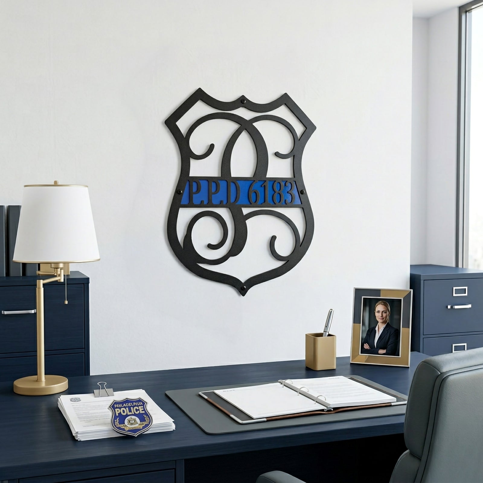 Custom police inspired metal monogram wall sign with blue stripe and badge number displayed in modern executive office