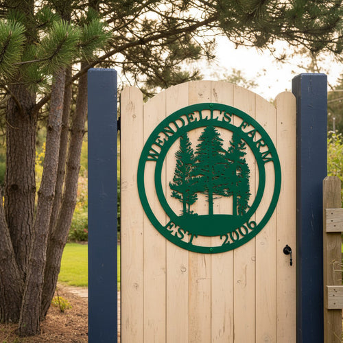A green round metal farm sign reading "Wendell's Farm Est. 2006" fixed to a light wood arched gate supported by dark blue posts at a property entrance.
