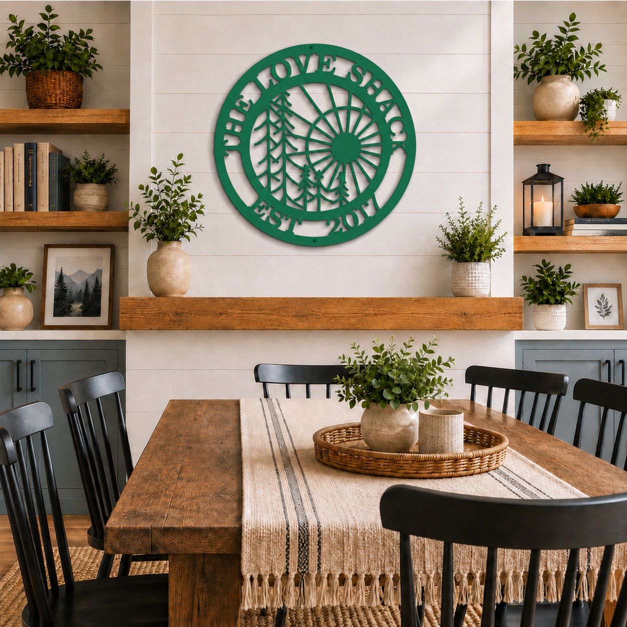 Green custom sun and pine tree metal wall sign with family name and established year displayed above a farmhouse fireplace mantel