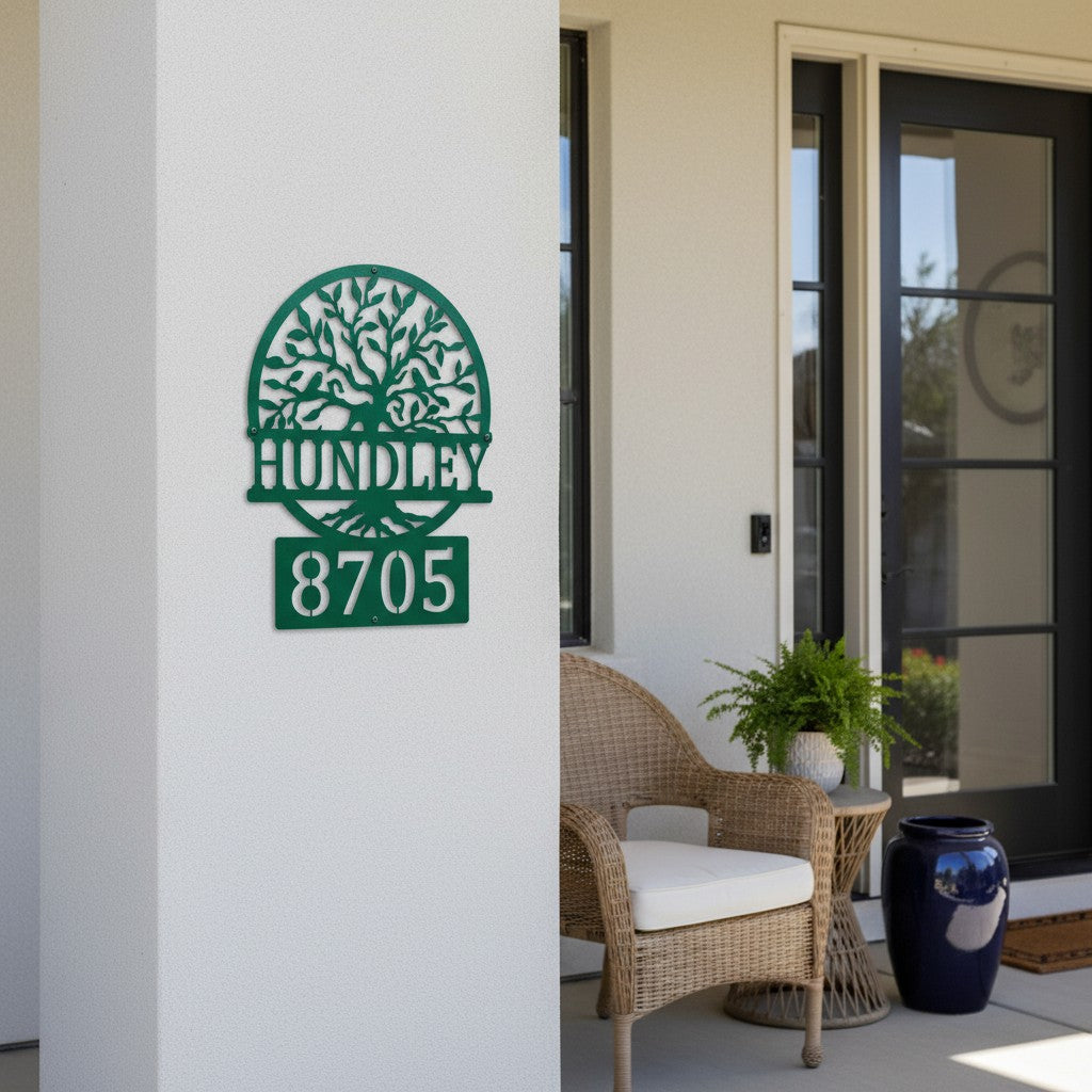 Custom Bionic Green metal address sign featuring a tree design, family name Hundley, and house number 8705 displayed on a covered front porch wall.