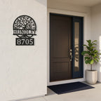 Custom Black Bronze metal address sign featuring a tree design, family name Hundley, and house number 8705 displayed beside a modern front entry door.
