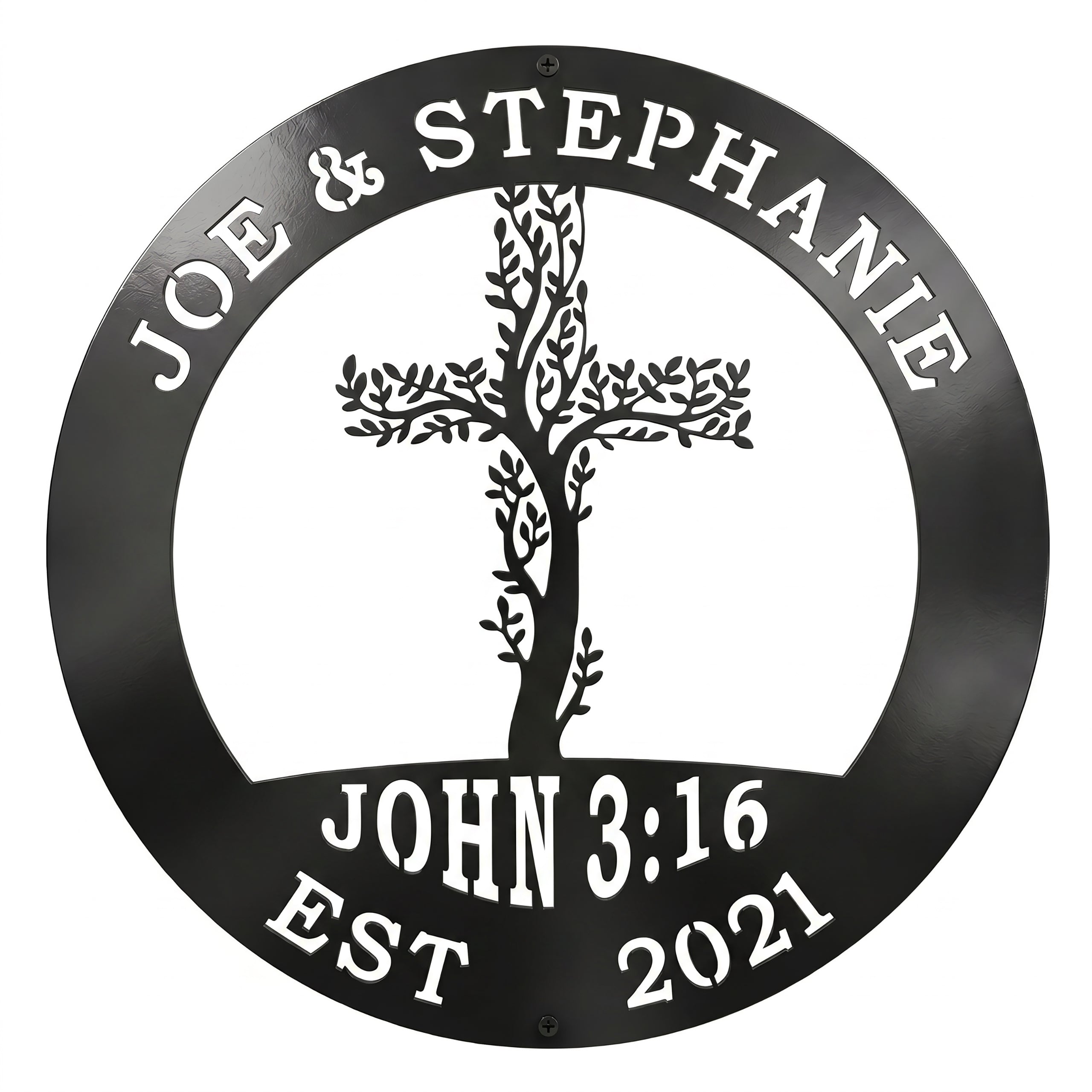 A circular metal sign finished in a glossy black color is displayed over a solid white background. The top rim is cut out with the names "JOE & STEPHANIE," the bottom features "JOHN 3:16 EST 2021," and the center showcases an intricate cross woven with climbing tree branches and leaves.