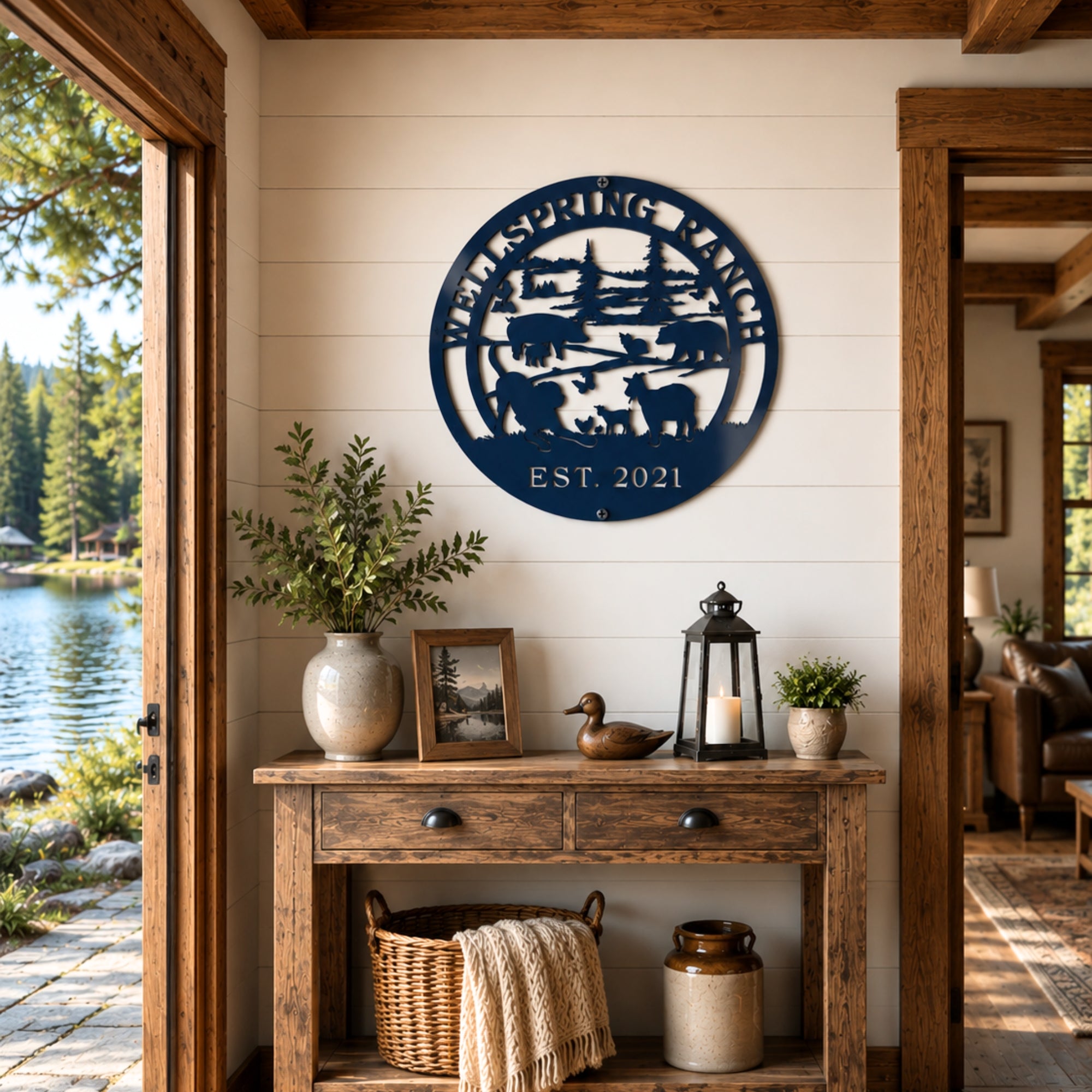 Navy blue custom ranch metal sign with farm animal silhouette mounted above rustic farmhouse console table