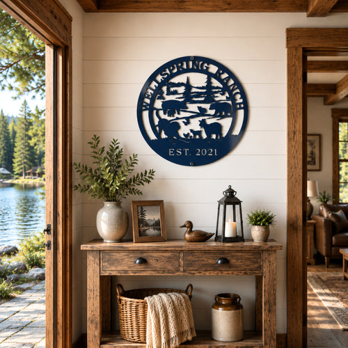 Navy blue custom ranch metal sign with farm animal silhouette mounted above rustic farmhouse console table