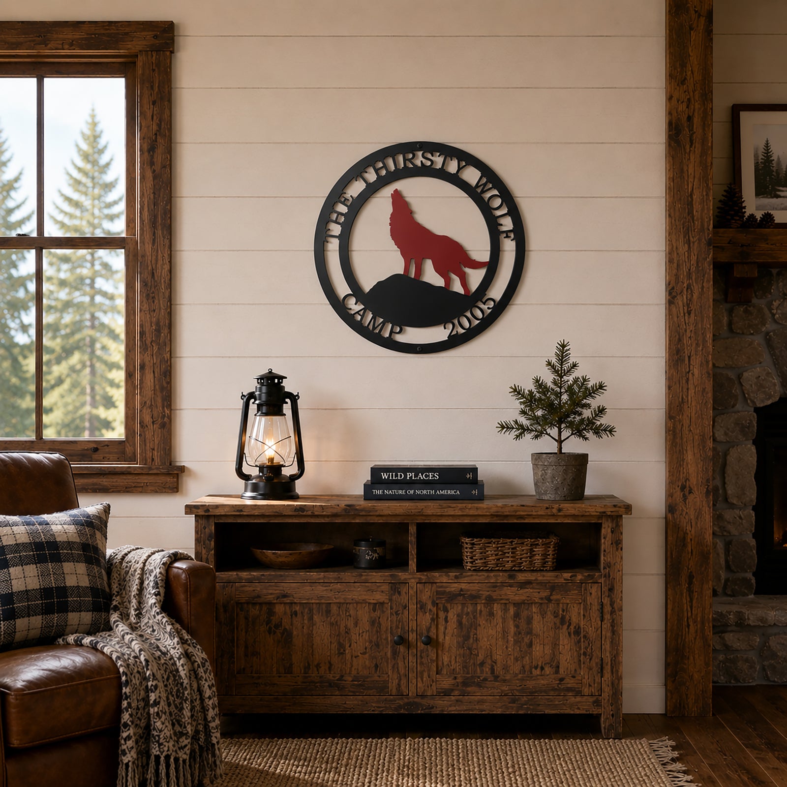 Custom wolf camp metal wall sign hanging above rustic wooden cabinet in cozy cabin living room décor