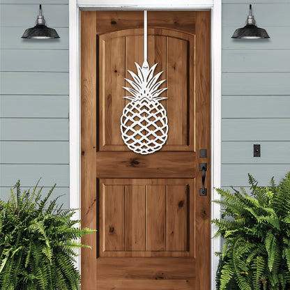 Pineapple Front Door Wreath - Customizable Metal Door Decor features a white pineapple cutout on a wooden door, symbolizing hospitality, perfect for enhancing home, porch, or garden aesthetics.