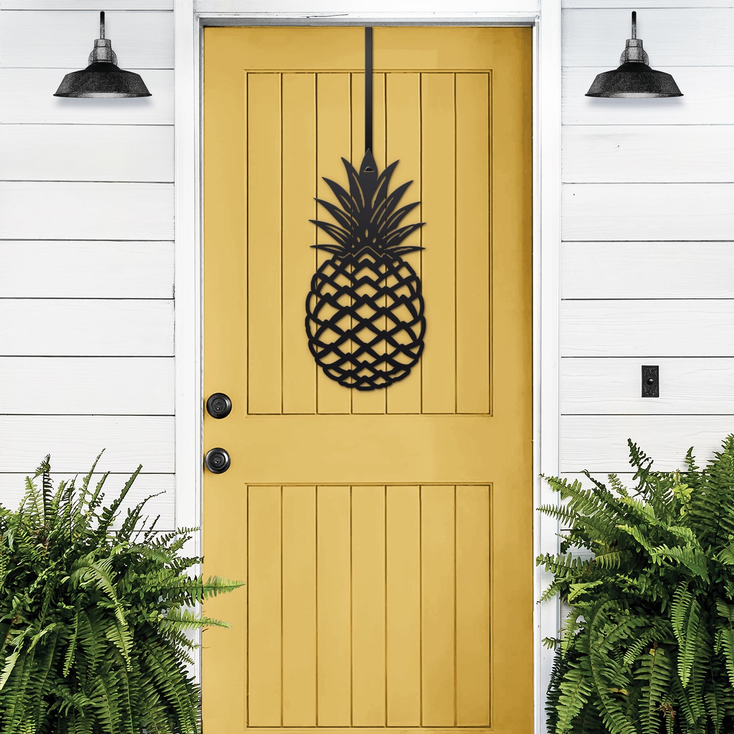 Welcome Pineapple Front Door Sign – Custom Door Sign, featuring a black metal pineapple on a vibrant yellow door, symbolizing hospitality and warmth, ideal for enhancing home décor and gifting.