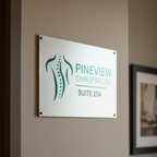 Custom brushed aluminum chiropractic office sign with standoff mounting displaying Pineview Chiropractic Suite 204 branding