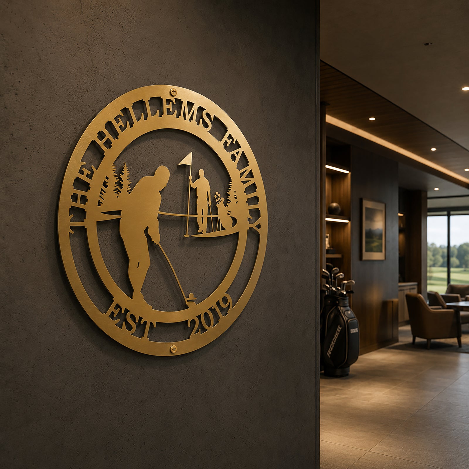 Premium metallic gold finish of the custom circular golf family sign styled on a dark concrete accent wall inside a modern luxury golf clubhouse lounge corridor with a golf bag in the background.