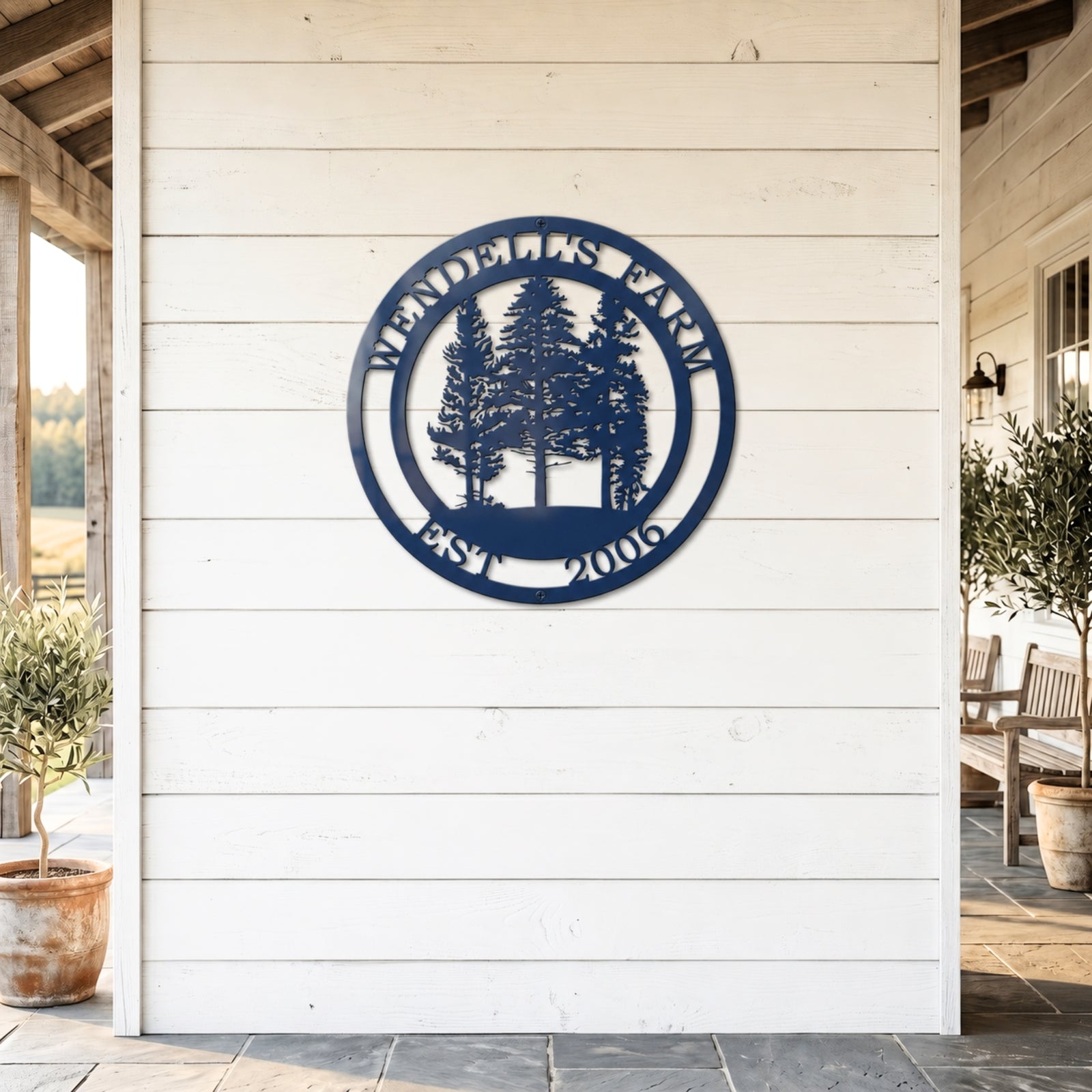 Custom navy blue ranch metal sign with farm animals and EST 2021 displayed on rustic farmhouse porch wall