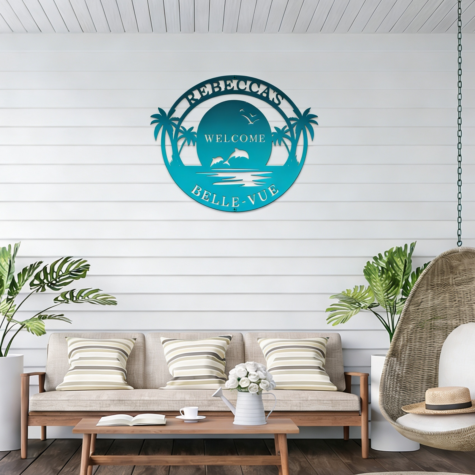 Rebecca Belle Vue turquoise welcome metal sign displayed on coastal patio wall