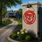 Red personalized Border Collie farm metal sign displayed on a stone gate pillar with farmhouse driveway and garden landscaping