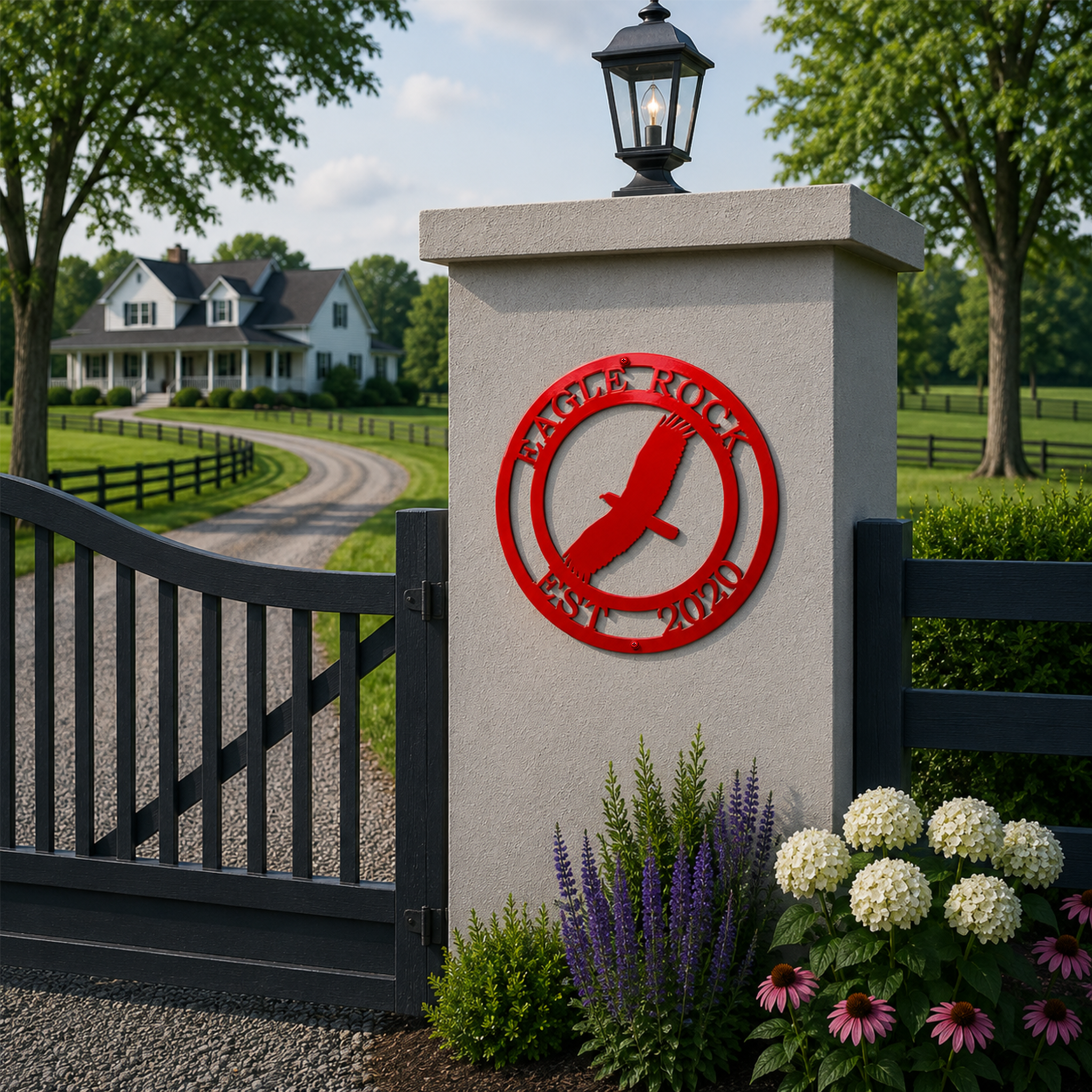 Red personalized eagle metal sign with Eagle Rock and Est 2020 mounted on an estate gate pillar