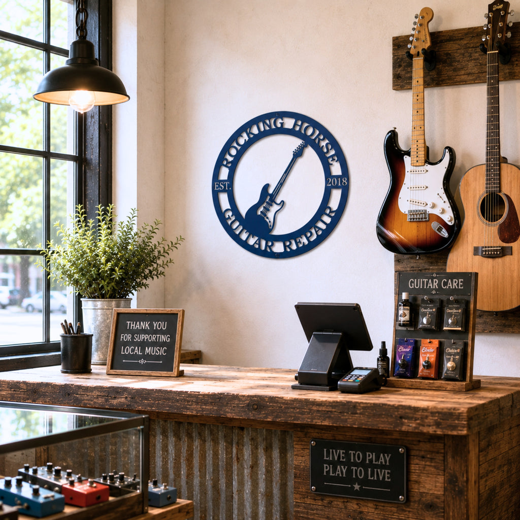 Blue personalized guitar repair metal sign mounted inside rustic guitar shop with hanging guitars counter and music accessories