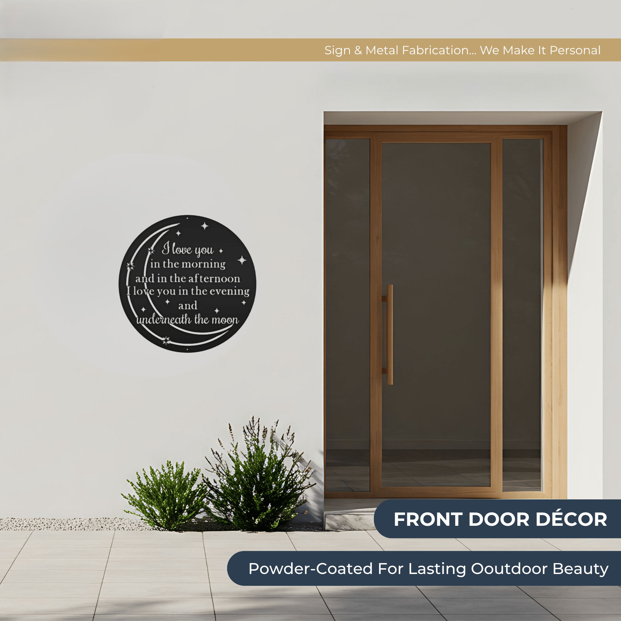 Outdoor entryway featuring a round black metal wall sign with romantic moon quote and star design mounted beside a modern wooden front door with powder coated weather resistant finish