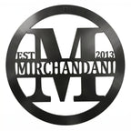 Personalized black family monogram metal sign with Merchandani name and established year 2013 on white background