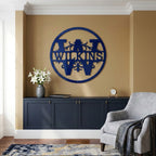 Blue custom metal monogram wall art with Wilkinson family name displayed above a modern console cabinet