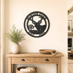 Personalized deer metal wall decor with farm name and established year displayed above wooden entryway table in farmhouse home