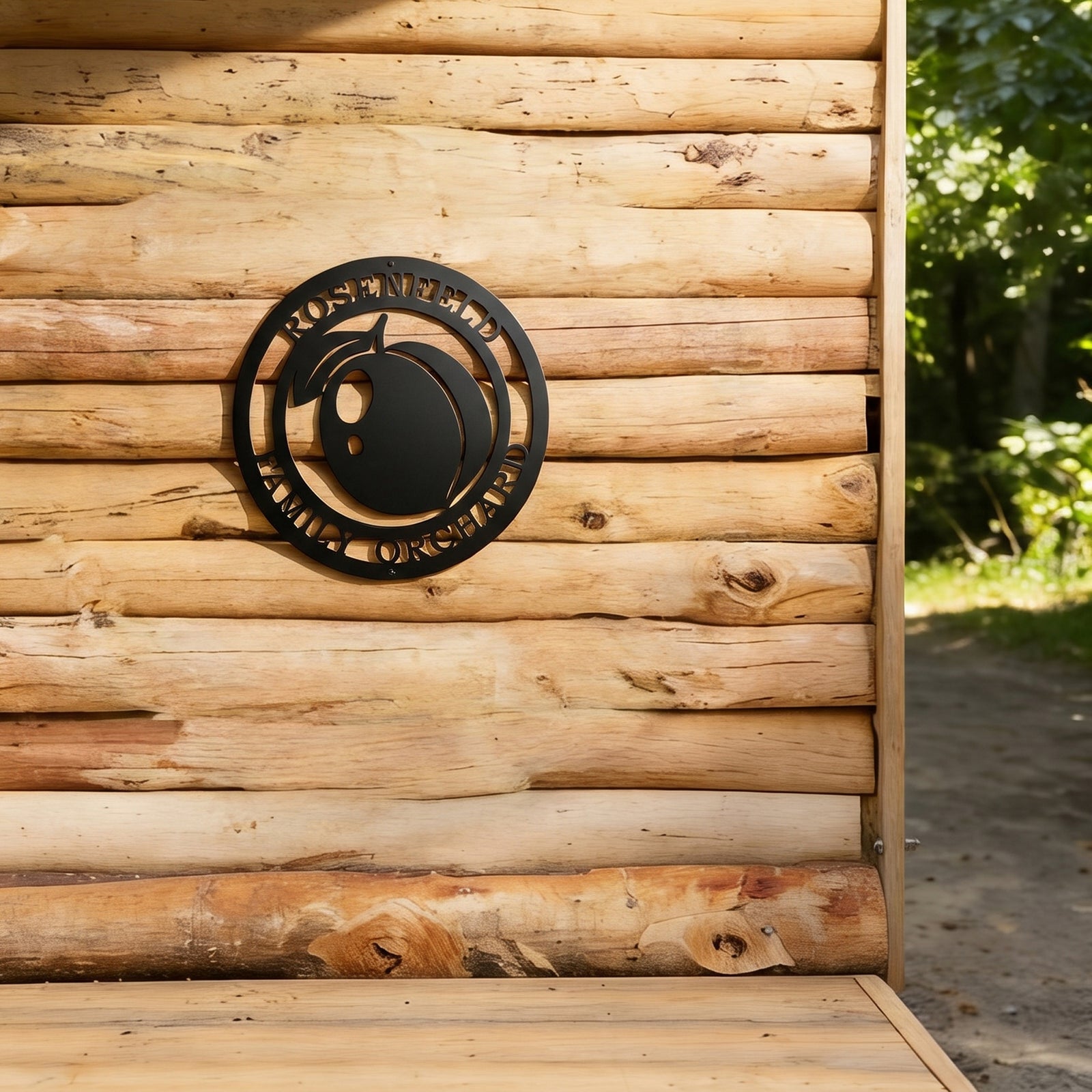 Custom peach orchard metal wall décor mounted on rustic log cabin exterior wall with natural outdoor setting