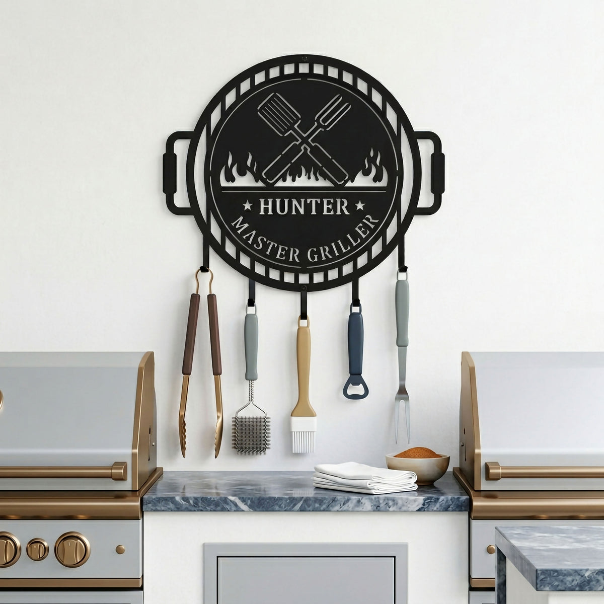 Satin black BBQ grill tool holder metal sign mounted above outdoor counter with grilling tools and barbecue accessories