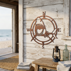 Tuscan copper shark compass metal wall art displayed on rustic white wood siding near beach house entry decor