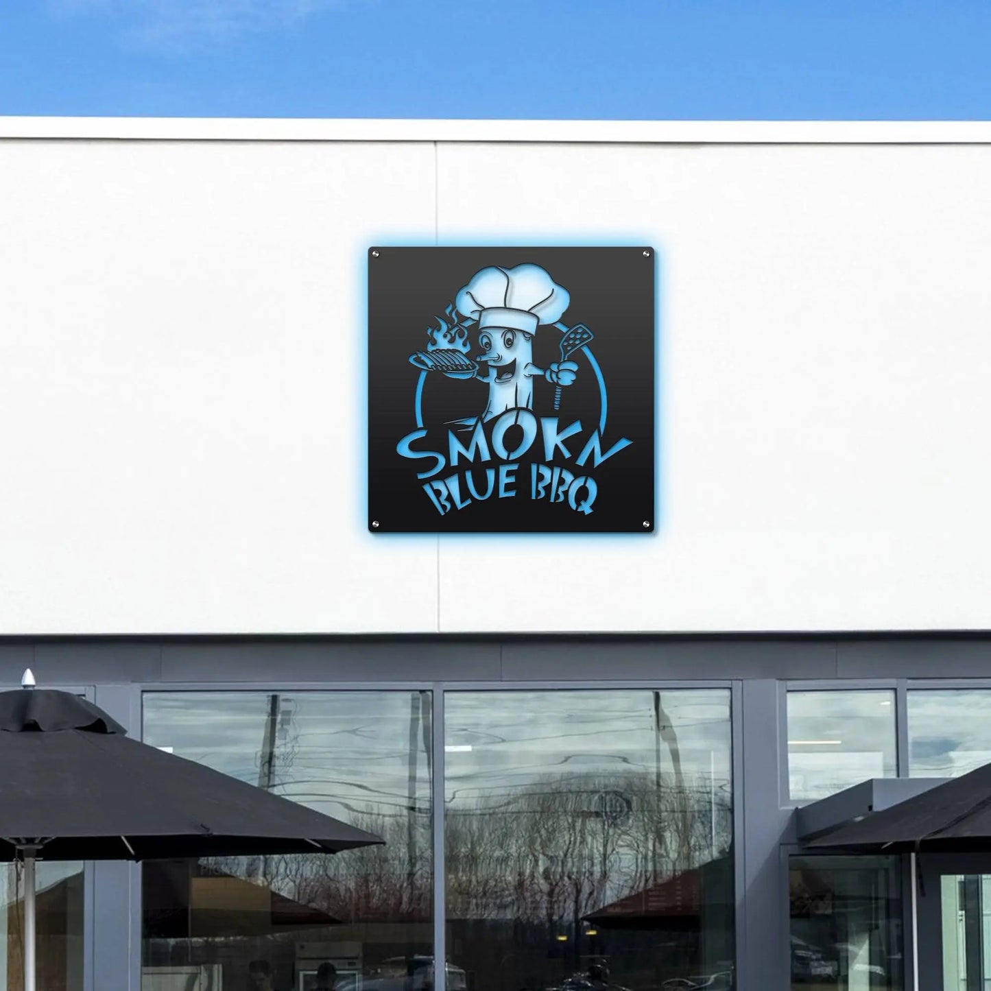 Custom STOREFRONT Brand/Business Logo Sign displayed on a building, featuring a cartoon character with a grill and spatula. Perfect for professional spaces, enhancing brand presence stylishly.