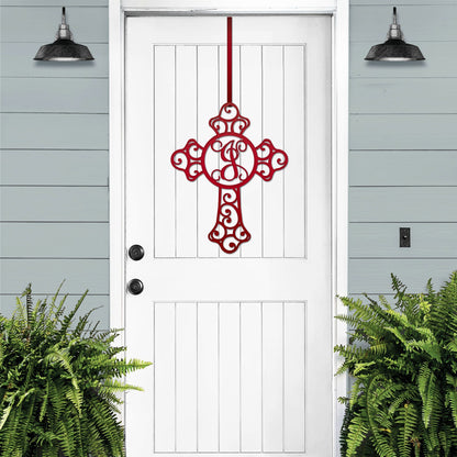 Custom Swirl Monogram Cross Door Sign displayed on a white door, featuring a personalized metal cross with a monogram letter. Ideal for front door, home, or garden decor, showcasing intricate craftsmanship.