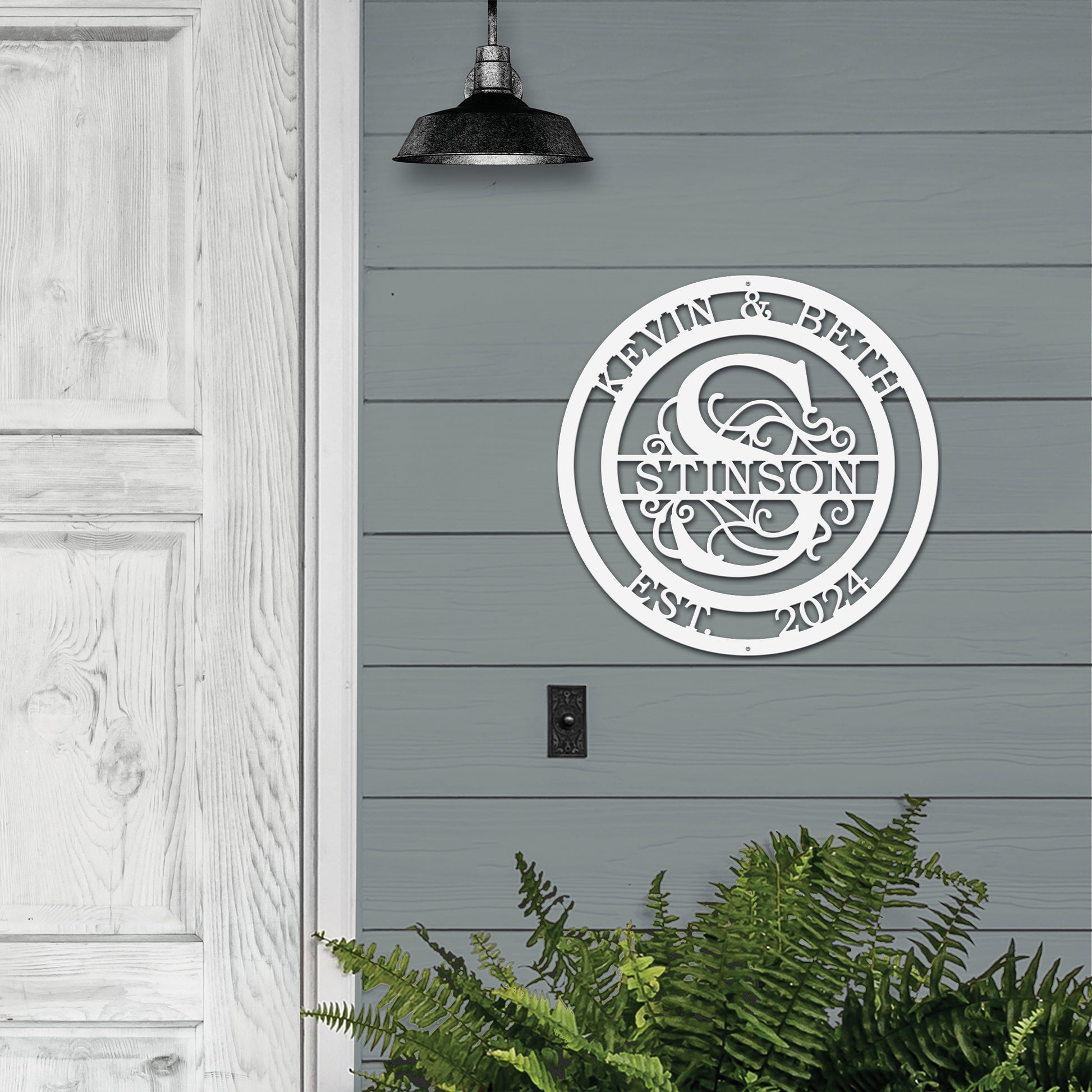 A custom metal sign featuring a couple's monogram and family name. Designed for indoor or outdoor use, perfect as a personalized wedding or housewarming gift.