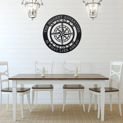 The Biggest Adventure Compass With Personalized GPS Coordinates sign, featuring a black and white compass design on a wall, ideal for personalized home or office decor by HouseSensationsArt.