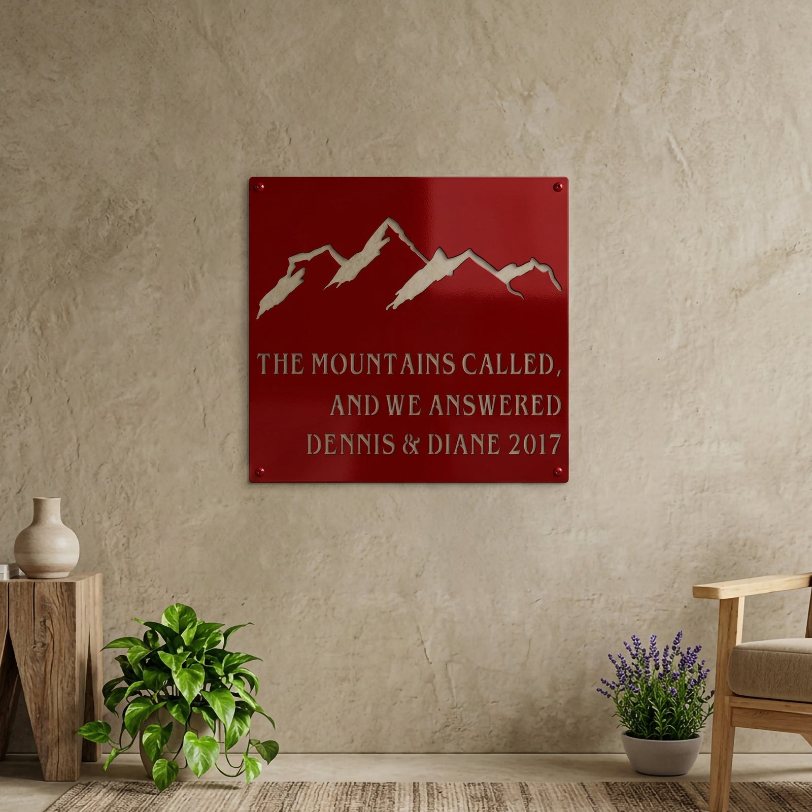 Royal blue mountain metal sign featuring custom family names and year, mounted on a covered porch with mountain views and outdoor plants.
