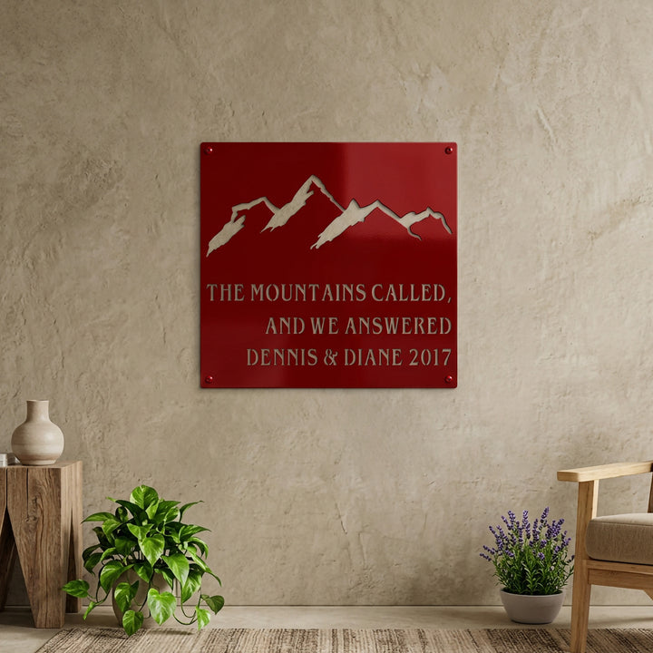 Royal blue mountain metal sign featuring custom family names and year, mounted on a covered porch with mountain views and outdoor plants.