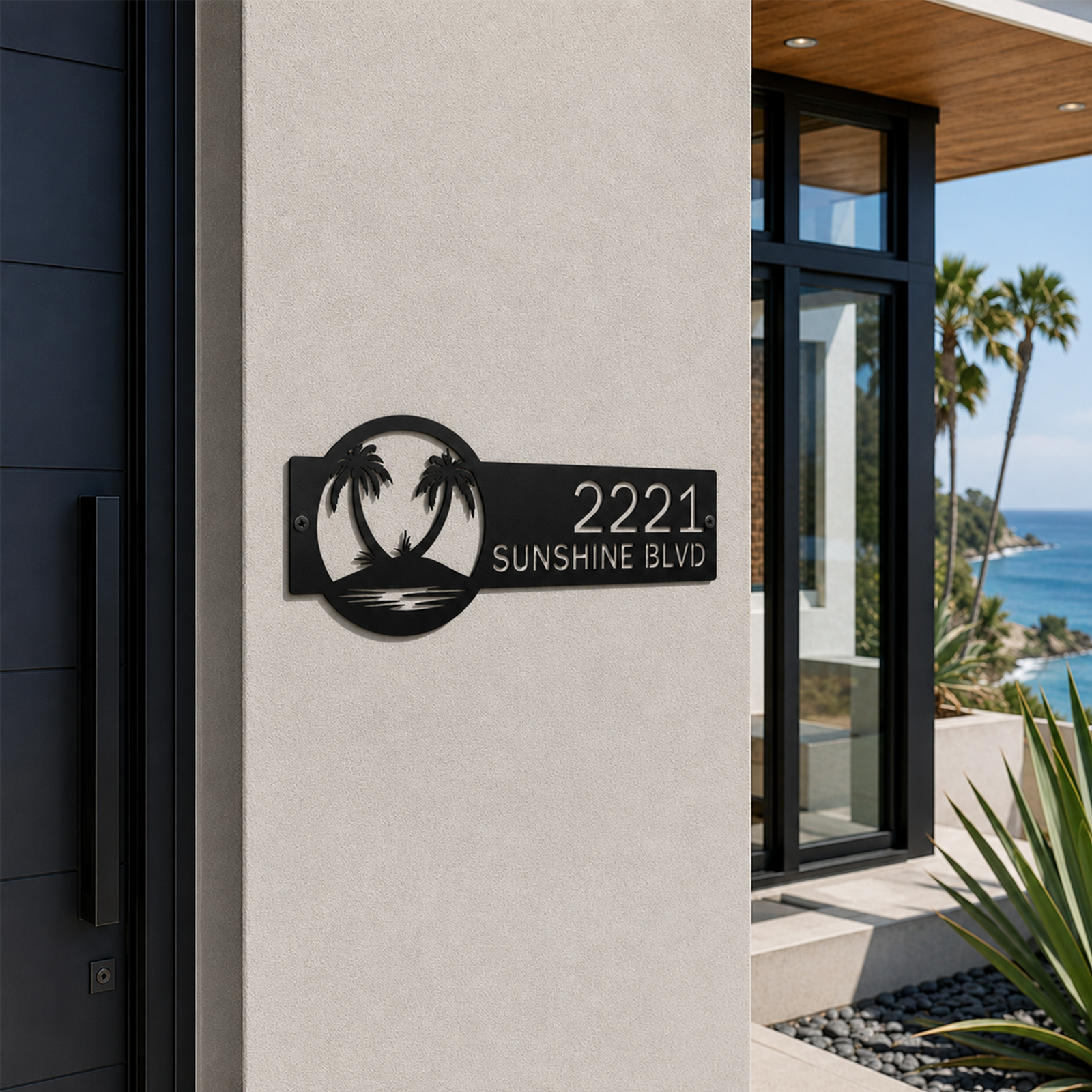 Black tropical palm tree metal address plaque with custom numbers mounted beside luxury beachfront home entrance
