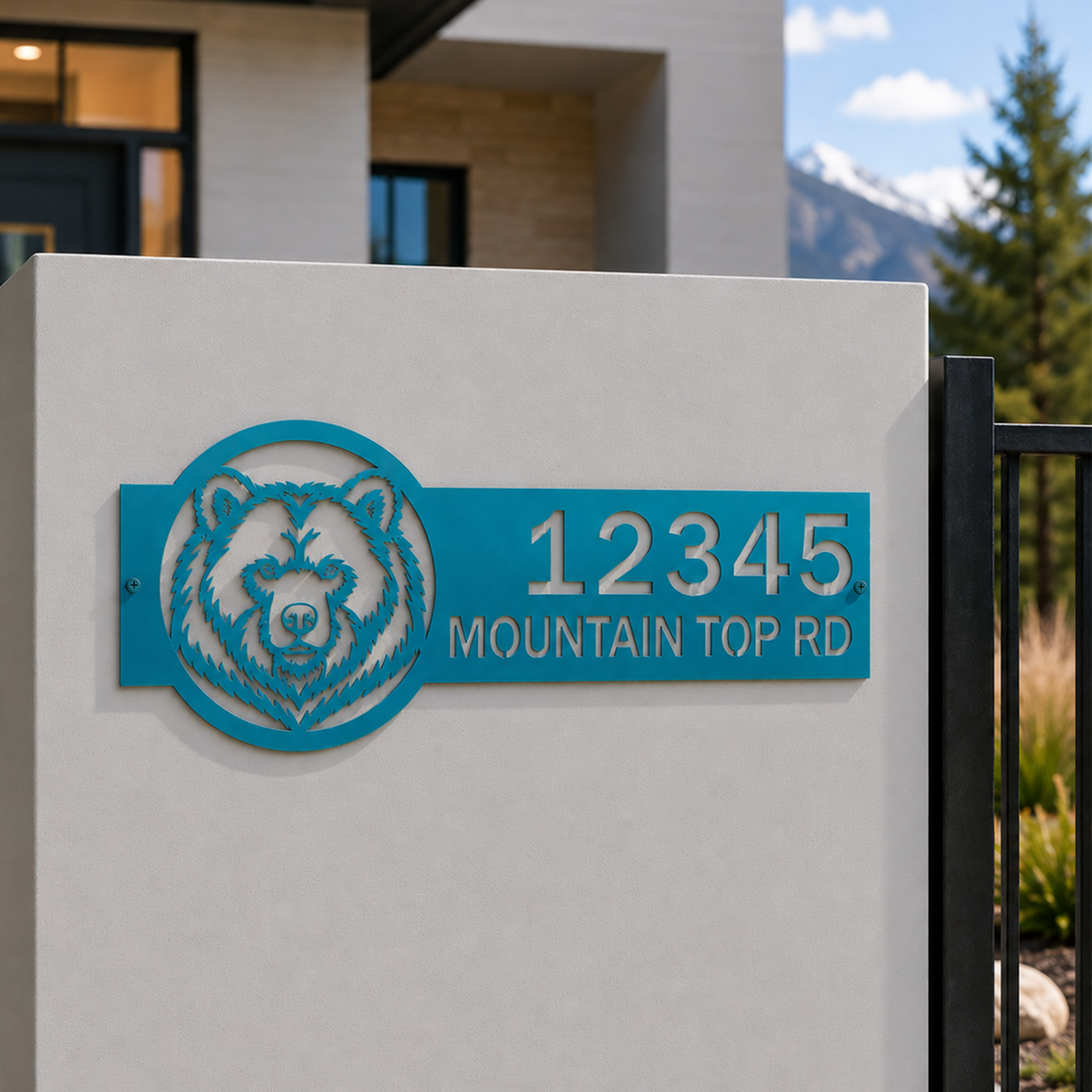 Turquoise personalized bear metal address sign with custom house numbers displayed on modern outdoor entry wall