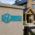 Turquoise rooster farmhouse address sign mounted on concrete entry wall with custom house number and country farm landscape metal artwork