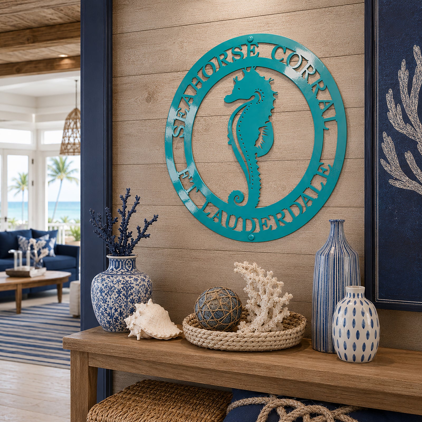 Turquoise seahorse metal wall sign displayed in coastal beach home entryway with nautical decor accents
