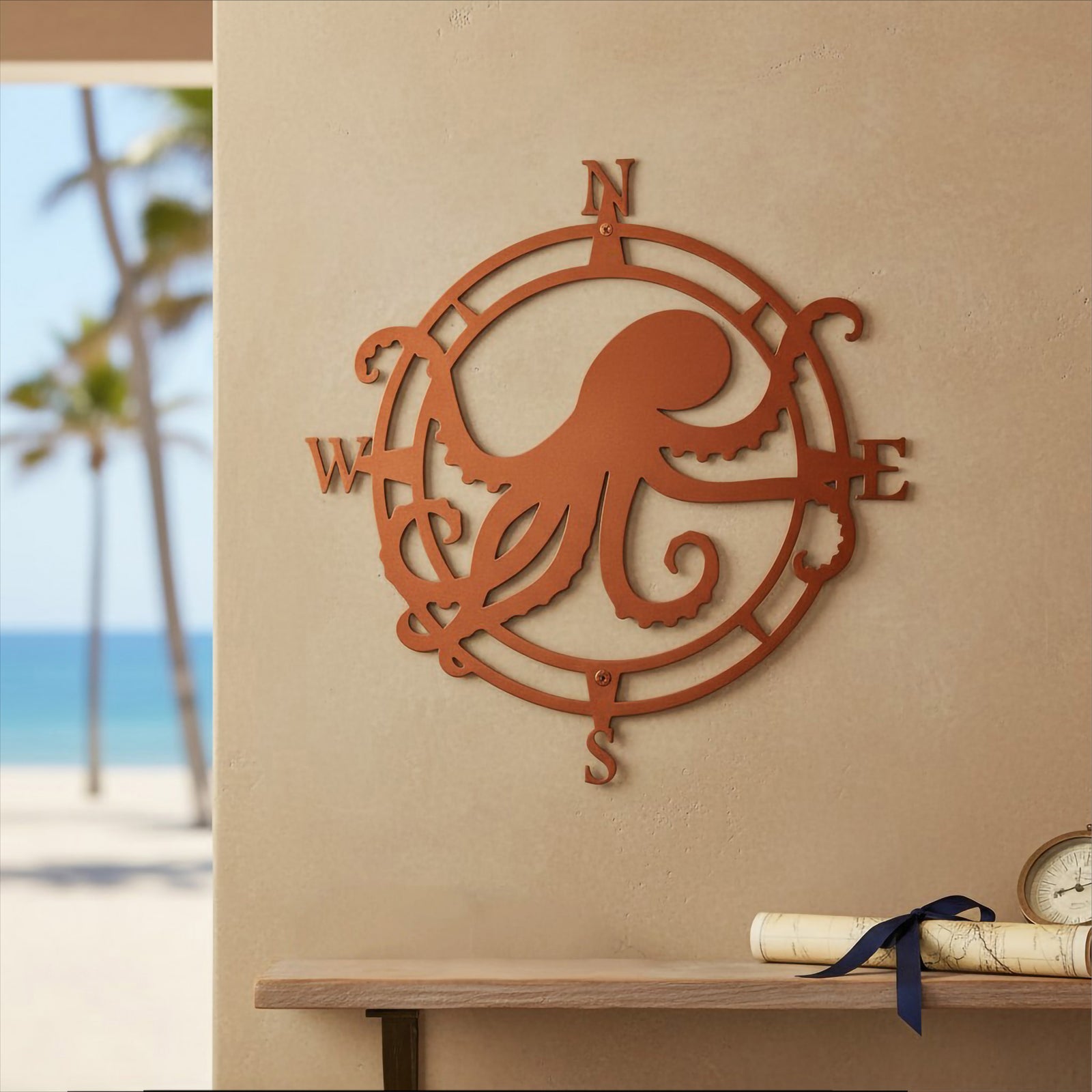 Copper orange custom metal octopus compass sign displayed on a warm beige wall above a wooden decorative shelf with a rolled vintage map and a beach view window.