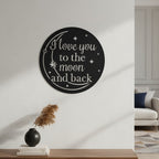 Bright orange custom metal text sign featuring a moon and stars design displayed on a white shiplap accent wall behind a cozy blue armchair.
