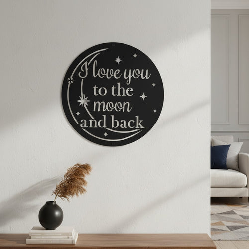 Bright orange custom metal text sign featuring a moon and stars design displayed on a white shiplap accent wall behind a cozy blue armchair.