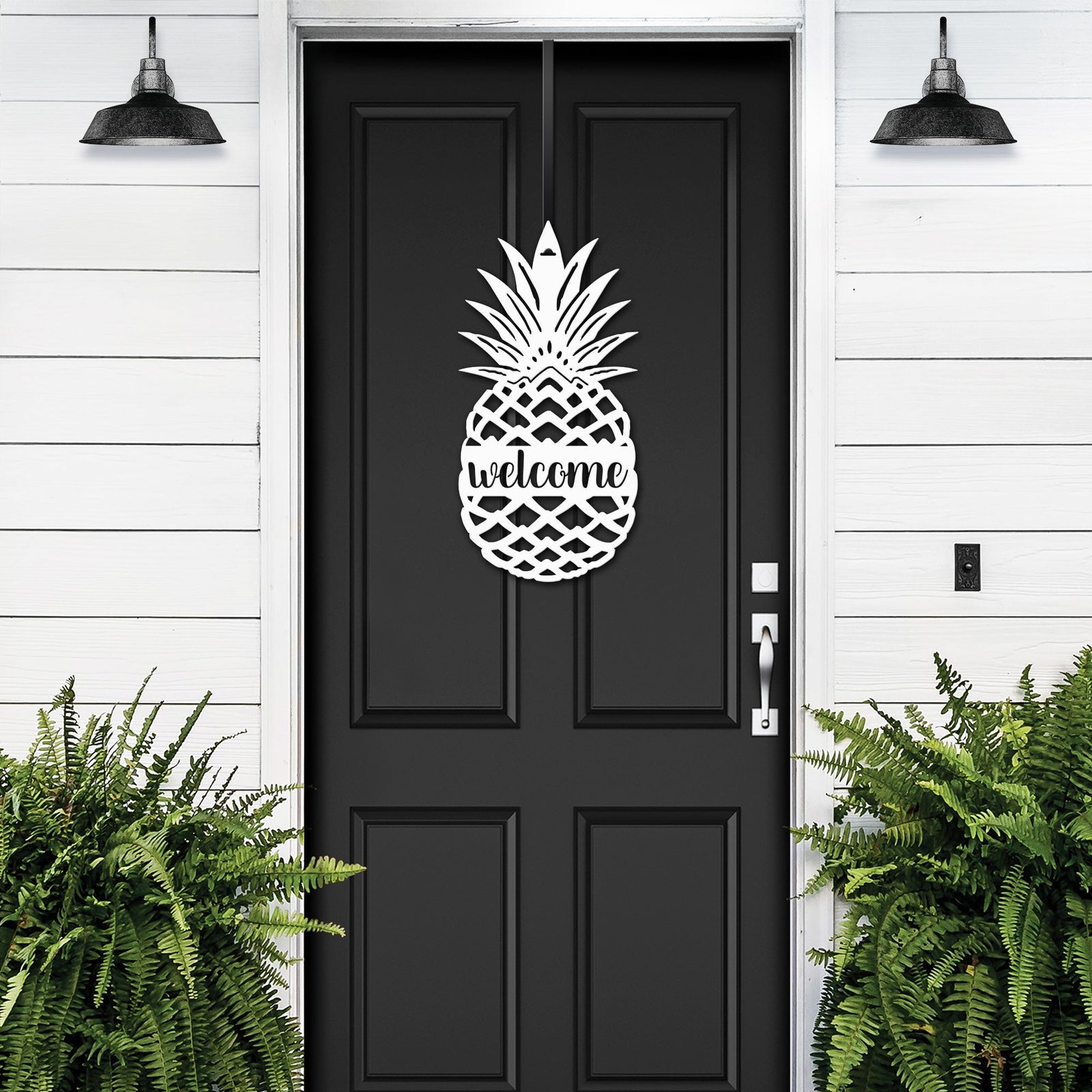 White pineapple welcome door sign displayed on black front door for warm farmhouse porch decor