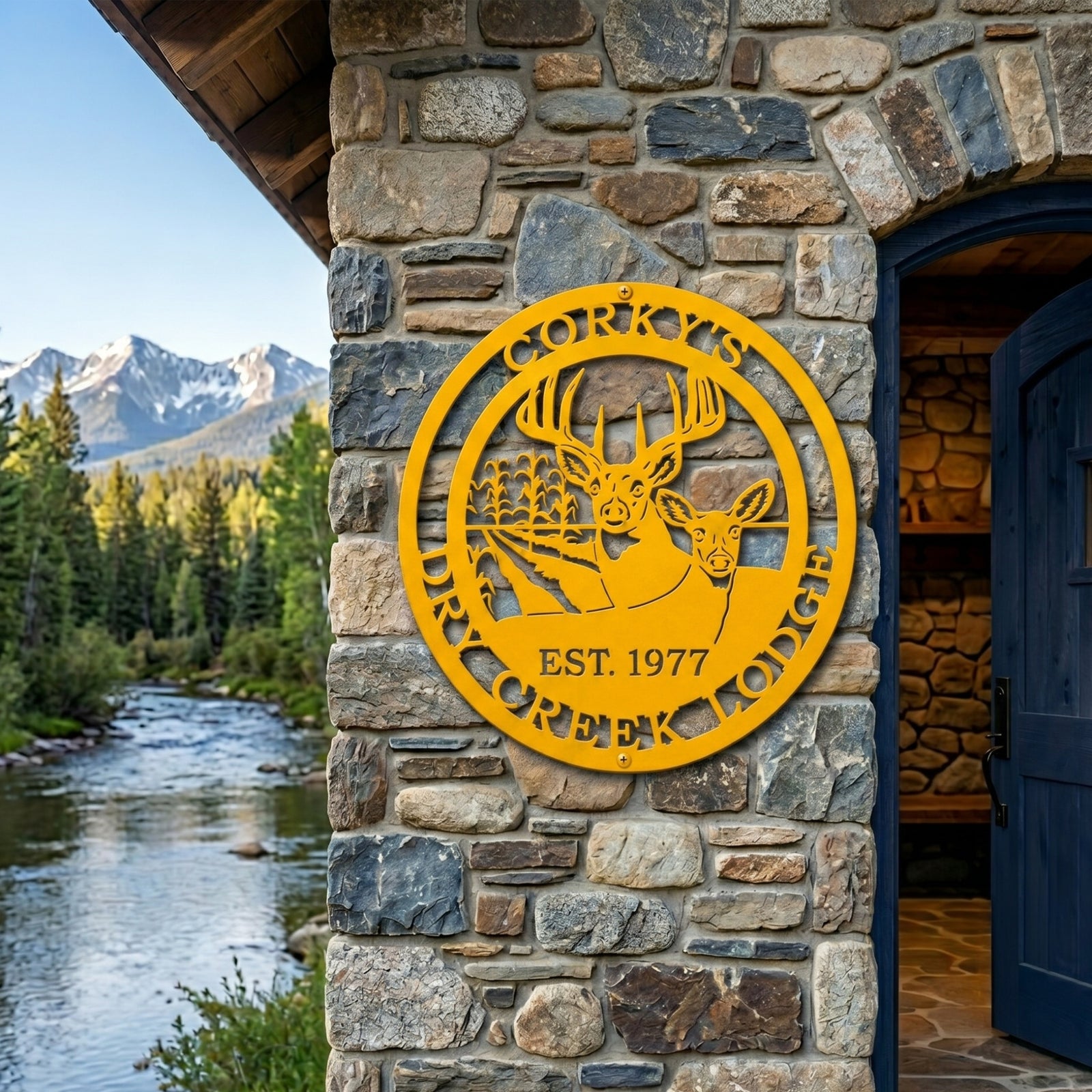 Golden yellow Corky’s Dry Creek Lodge metal wall sign with buck and doe design displayed on stone lodge exterior by mountain creek