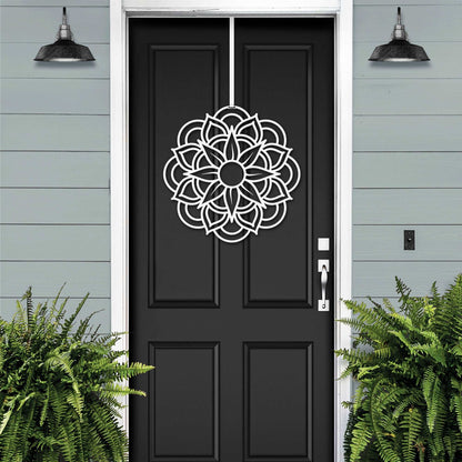 a black front door with a flower design on it