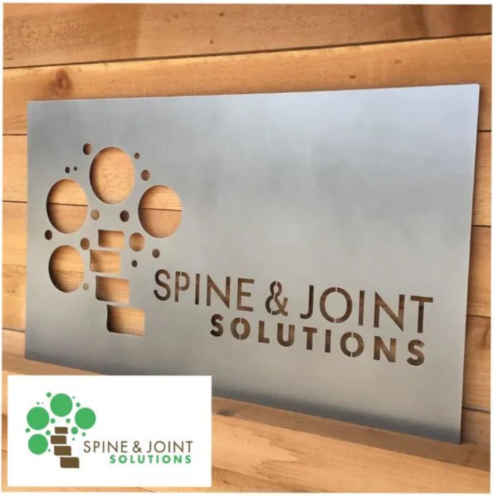 Custom LED office and storefront metal sign featuring “Spine & Joint Solutions” text, designed for illuminated business signage, professional office branding, and outdoor display.