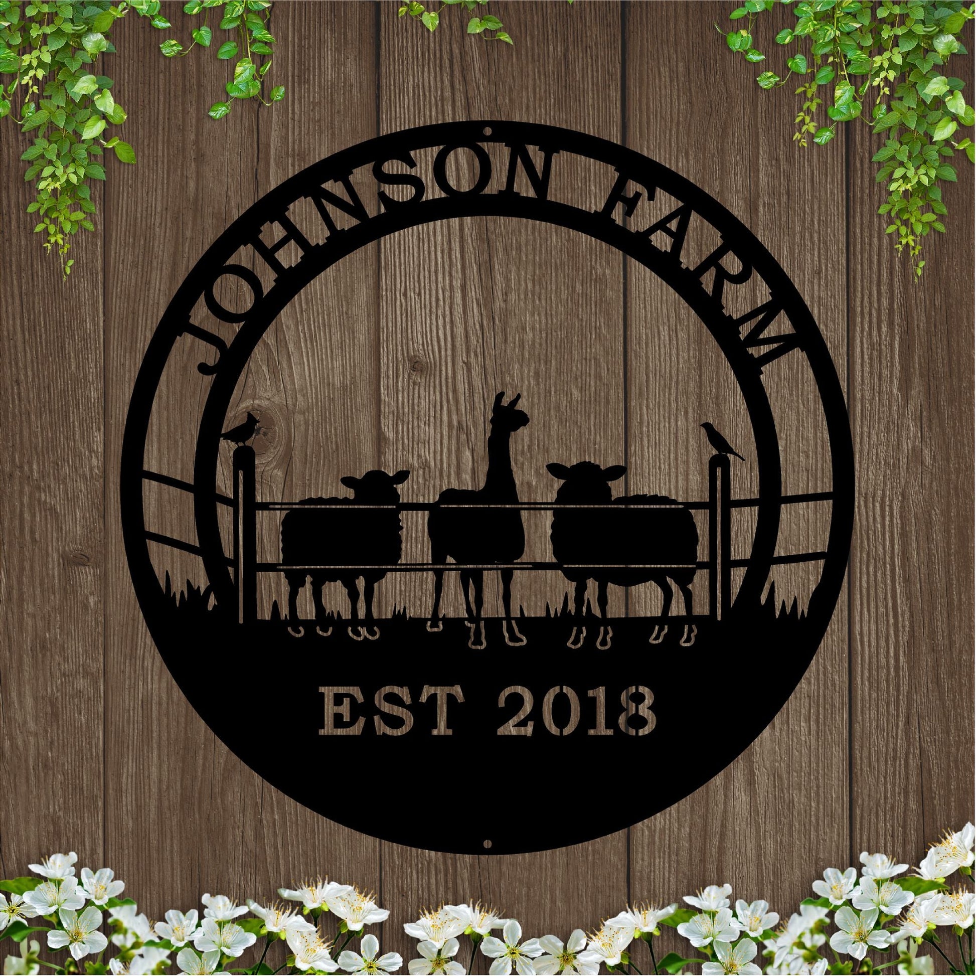 A black custom laser cut metal ranch sign showing alpaca and sheep behind fence, with “JOHNSON FARM EST 2018” text, outdoor farm decor.