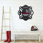Firefighter-themed wall décor with boots and helmet on wooden bench against white wall, personalized Maltese Cross sign display, HouseSensationsArt