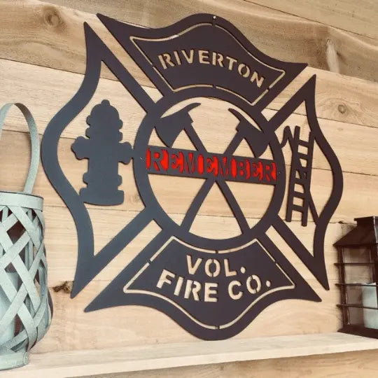 Personalized Firefighter Maltese Cross Axes, Ladder, Hydrant Address Sign displayed on a wood wall, highlighting its intricate metalwork design and durable craftsmanship suitable for home décor or as a housewarming gift.